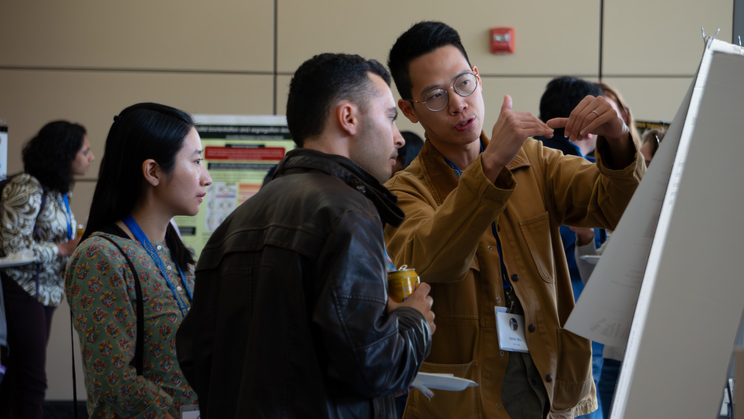 Kevin Wu discussing his research at the poster session