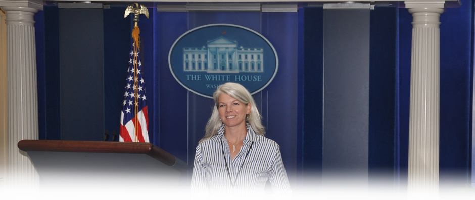 Dr. Mary Maxton in front of a White House podium