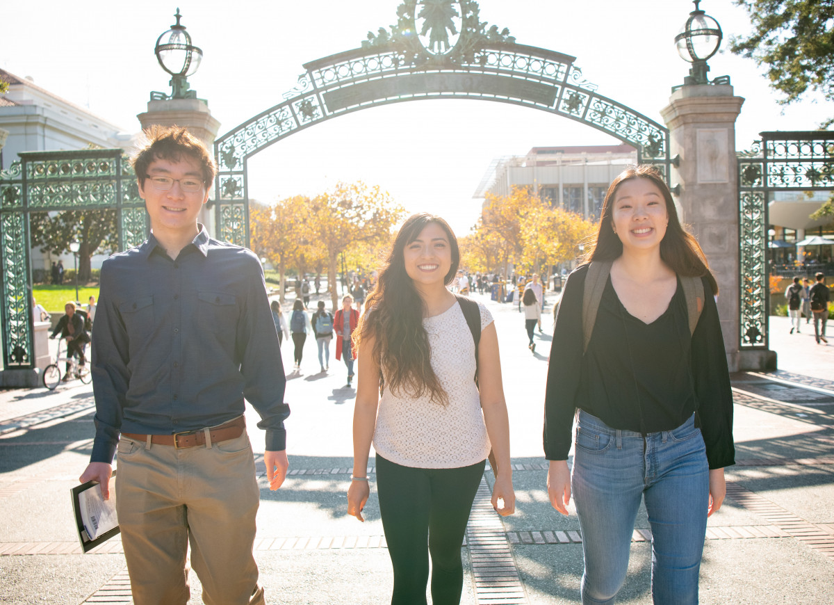 3 students walking through Sather gate, Photo credit: Keegan Houser